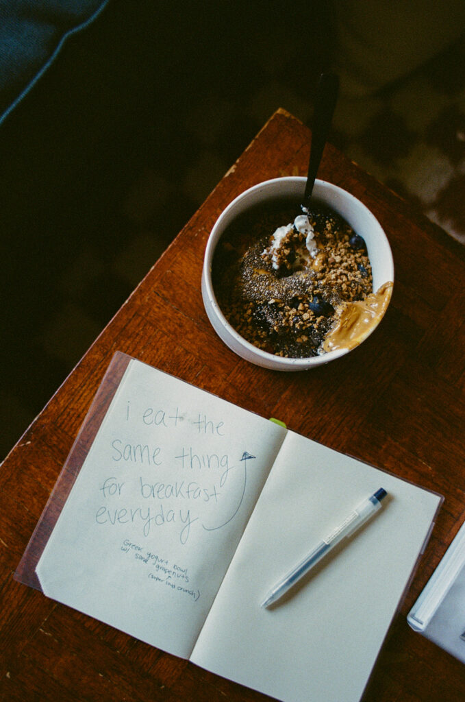 Documentary photograph of Ali Miller's everyday breakfast beside a handwritten journal inside her Nashville home.
