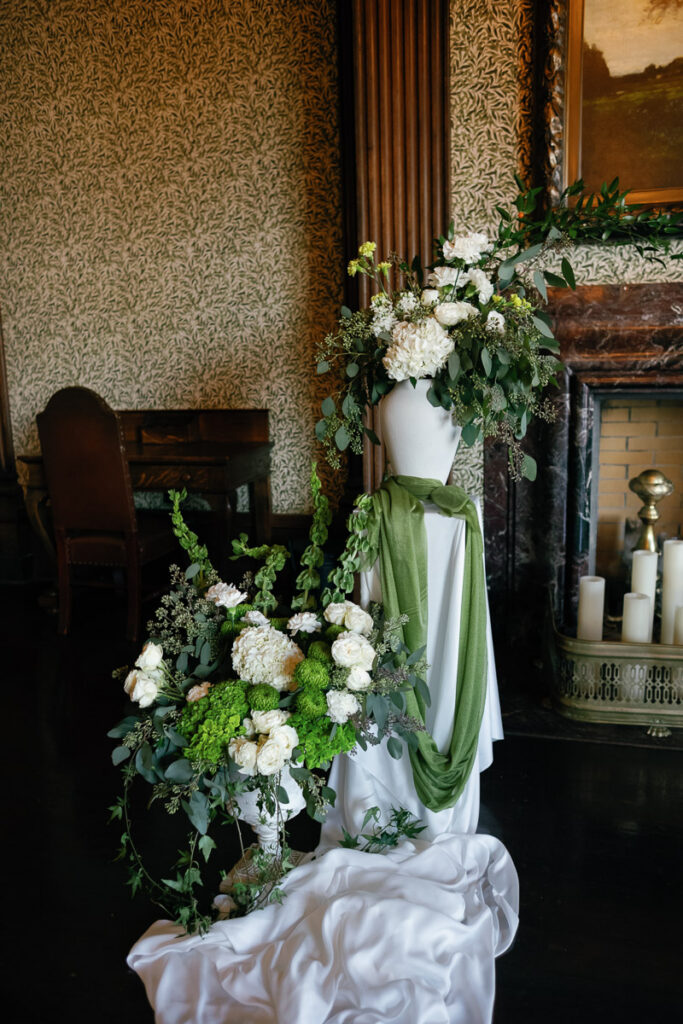Gorgeous wedding floral installations frame historical fireplace at University Club of San Francisco
